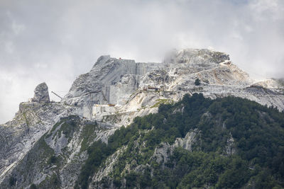 Low angle view of the marble quarry against the sky