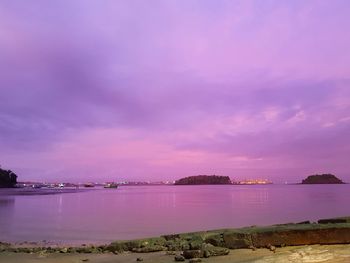 Scenic view of lake against sky during sunset