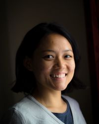 Close-up portrait of a smiling young woman