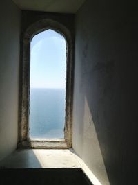 Sea seen through arch window