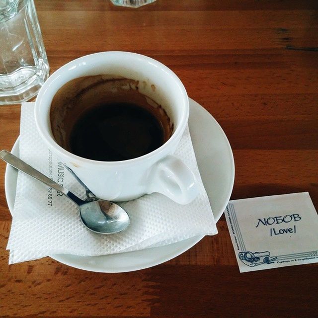 indoors, food and drink, drink, coffee cup, table, refreshment, coffee - drink, freshness, still life, coffee, saucer, cup, high angle view, close-up, spoon, tea cup, tea, no people, tea - hot drink, paper