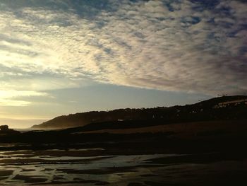 Scenic view of landscape against sky during sunset