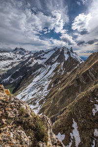 Scenic view of snowcapped mountains against sky