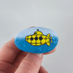 Close-up of person holding hand against white background