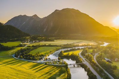 Aerial view of landscape during sunset