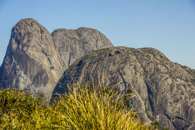 Low angle view of rock formation against sky