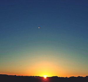 Scenic view of silhouette landscape against clear sky during sunset