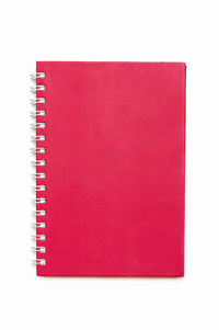 Close-up of empty red book against white background