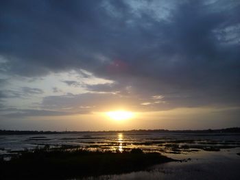 Scenic view of sea at sunset