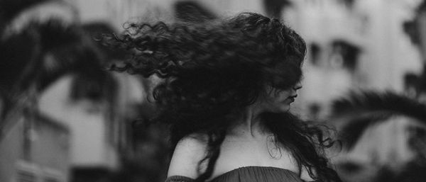 Portrait of young woman looking down