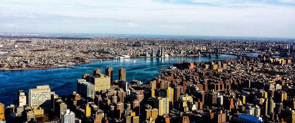 High angle view of modern city buildings against sky