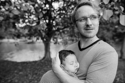 Portrait of mother with baby and tree