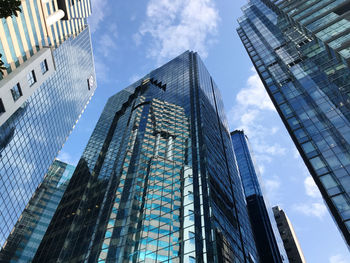 Low angle view of modern buildings against sky