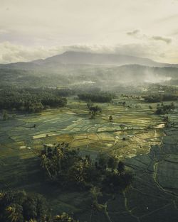 High angle view of farm against sky during sunset