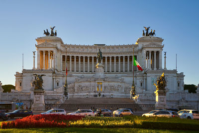 Low angle view of statues against sky