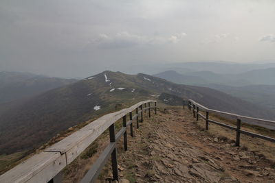 Scenic view of landscape and mountains against sky