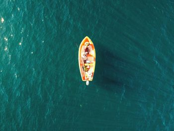 Aerial view of a lonely rowboat at sea