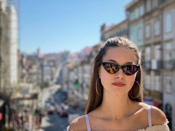 Portrait of young woman wearing sunglasses