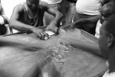 High angle view of people playing dominoes