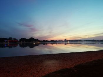 Scenic view of beach against sky during sunset