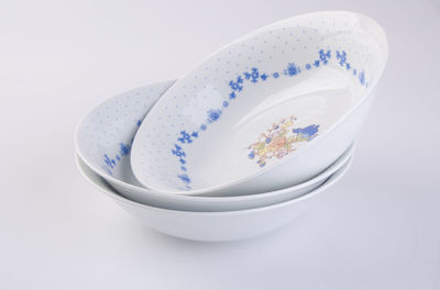 Close-up of bowls on white background