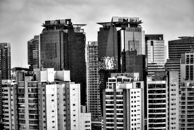 Buildings in city against sky