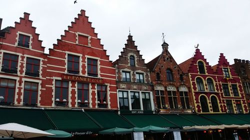 Low angle view of buildings against clear sky