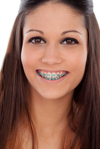 Close-up portrait of a smiling young woman