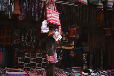 Clothes hanging at market stall for sale