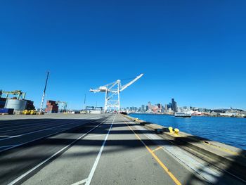 Low angle view of airplane against clear blue sky
