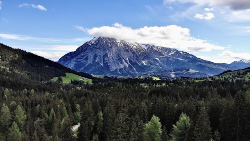 Scenic view of snowcapped mountains against sky