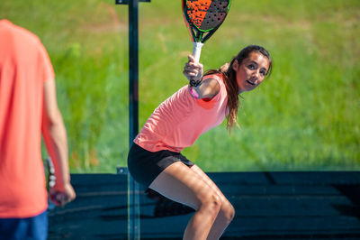 Full length of woman playing tennis