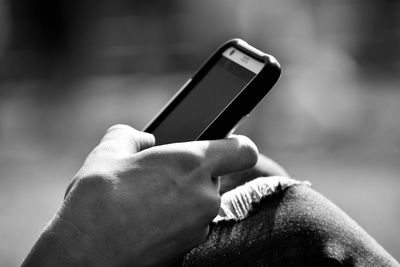 Close-up of man using mobile phone