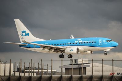 View of airplane against cloudy sky