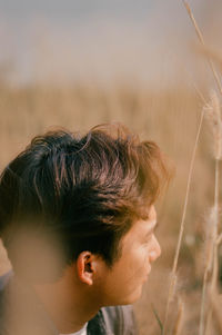 Portrait of man looking away outdoors