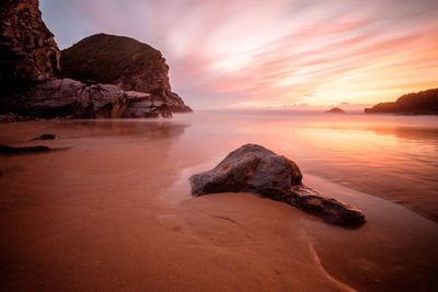 Scenic view of sea at sunset