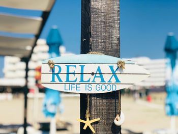 Relax wooden sign on the beach