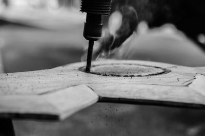 Close-up of hands on water