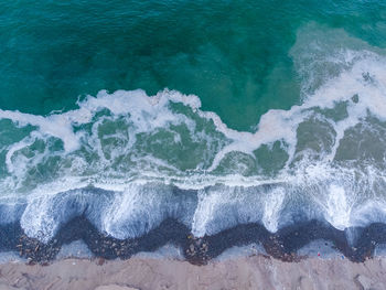 High angle view of surf on beach