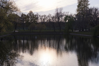 Scenic view of lake against sky at dusk