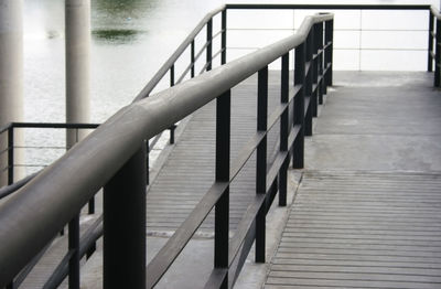 Staircase leading to pier over sea
