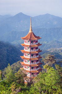 View of traditional building against mountain range