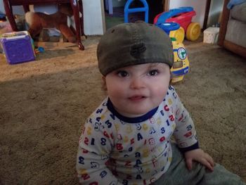 Close-up portrait of cute boy at home