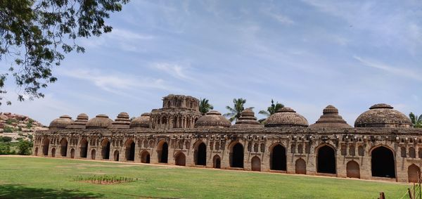 Historic building against cloudy sky