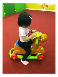 Boy playing with toy at home