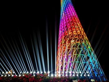 Low angle view of illuminated ferris wheel at night