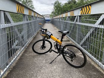 Yellow bike and iron bridge