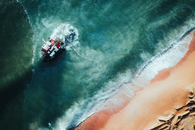 High angle view of man surfing in sea