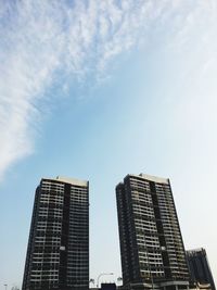 Low angle view of modern buildings against sky