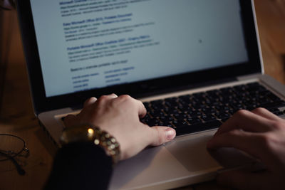 Midsection of person using mobile phone